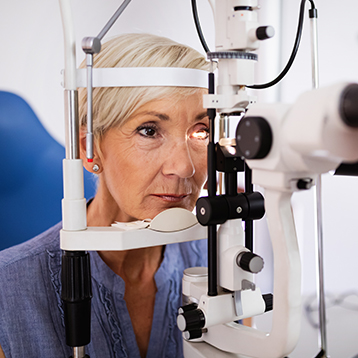a woman having an eye exam - represent ophthalmology